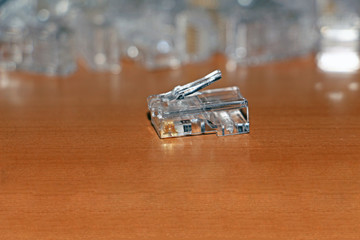 network connector RJ-45 on a wooden table