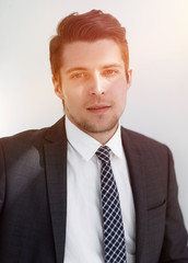 closeup.the face of a successful young man