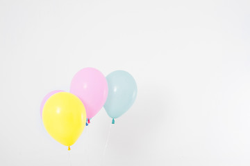 Colorful party balloons background. Isolated on white. Copy space