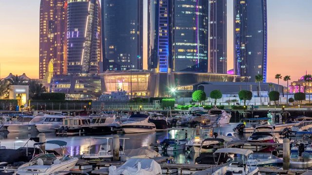 Al Bateen marina Abu Dhabi day to night timelapse with modern skyscrapers on background