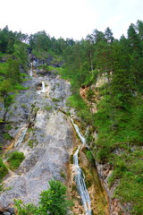 Waterfall with a crystal clear water flowing in Almbach gorge near Berchtesgaden in Eastern...