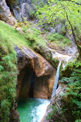 Waterfall with a crystal clear water flowing in Almbach gorge near Berchtesgaden in Eastern...
