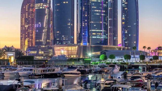 Al Bateen marina Abu Dhabi day to night timelapse with modern skyscrapers on background