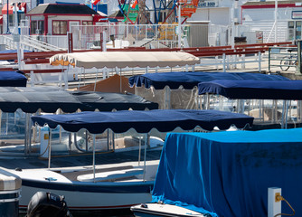 Fototapeta na wymiar electric boat canopies at the Balboa fun zone in Newport Beach California