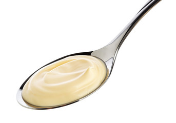 Fototapeta na wymiar Sour cream in spoon isolated on white background with clipping path