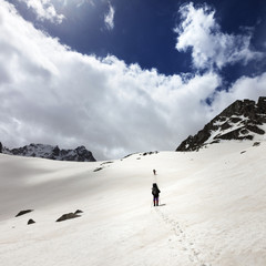 Two hikers in snowy mountains