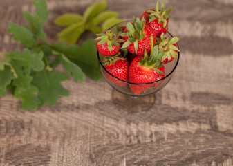 Strawberry in bow on white table. Strawberries top view. Beautiful strawberries.