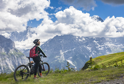 nice and ever young senior woman riding her e-mountainbike below the Eiger Northface near Grindelwald and Wengen, Jungfrauregion, Switzerland © Uwe