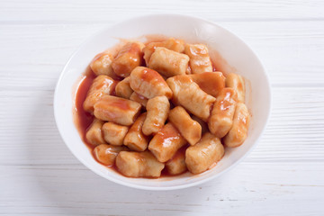 Homemade potatoes gnocchi with tomato sauce .