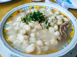 Patasca: Soup made with hardy large white hominy corn and tripe in a light beef broth.