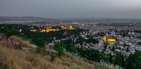 Sunset over Granada and Alhambra with first lights