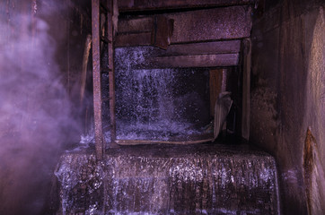 Breakthrough water. Underground water. Stairway in the sewer.