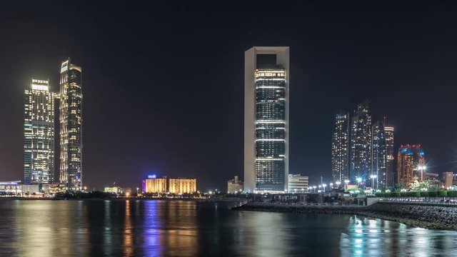 Panorama view of Abu Dhabi Skyline and seafront at night timelapse, United Arab Emirates