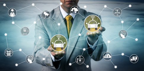 Fototapeta premium Manager Connecting Two Robotic Cars Via V2V Tech