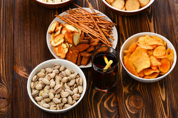 Snacks on a wooden background. Space for text or design.