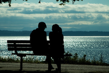 couple on park bench near water