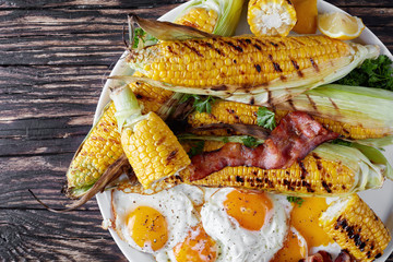 close-up of grilled corn in cobs