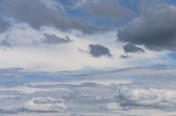 White and gray rain clouds with blue sky in summer day