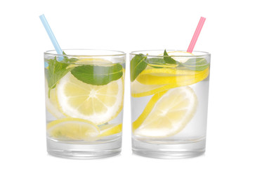 Homemade lemonade with mint in glasses and with a straw on a white background. isolated