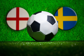 Fototapeta premium Soccer 2018. Creative concept. Soccer ball on green grass. Support your country or cheer concept.