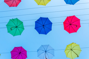 Colorful umbrellas background in the sky. Street decoration.
