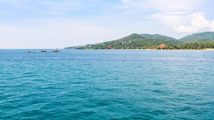 Beautiful nature landscape of blue sky sea and lantern on the rocks in summer at Ko Pha Ngan island in Gulf of Thailand is a famous attractions of Surat Thani province, Thailand, 16:9 widescreen