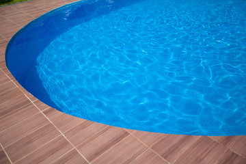 Fototapeta na wymiar beautiful blue pool in sunny summer weather