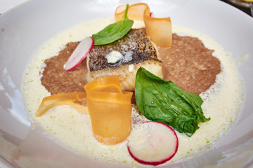 Halibut on buckwheat polenta with a creamy sauce and caviar