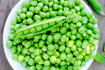 Pods of young green peas and pea
