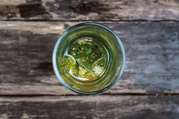 Antirrhinum flower essential oil on wooden background. Herbal medicine. Naturopathy.