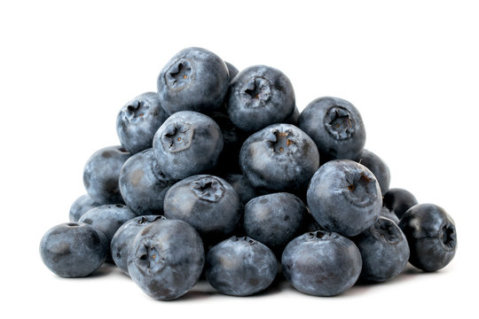 A bunch of ripe blueberries on a white, close-up. Isolated.