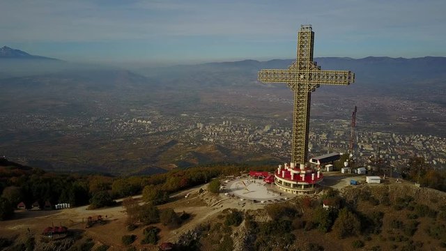Drone shot of Millennium cross in the mountains above Skopje, constructed as a memorial to 2,000 years of Christianity, in Macedonia