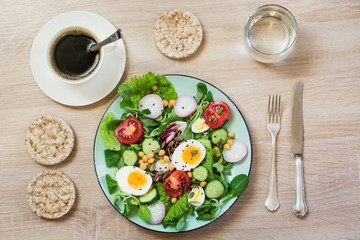 HFresh salad from vegetables and eggs for proper nutrition. Summer food. Top view, copy space
