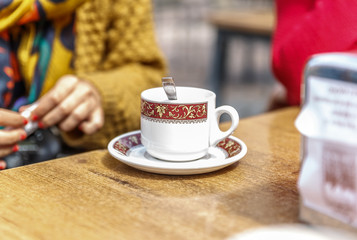 Cup of coffee on top of a wooden table