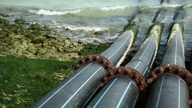 Pipes for intake of sea water and desalination in Doha, Qatar. Desalinization of sea water for city needs, water intake from Persian Gulf, Arabian Peninsula