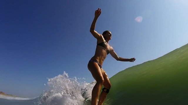 Surfer Girl Riding Wave