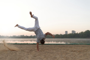 Athletic man workout on the sunrise