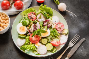 Fresh salad from vegetables and eggs for proper nutrition. Summer food.