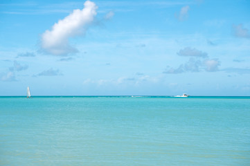 Tropical sea resort. Idyllic scene tropical vacation seaside. Motor sailing ship ocean blue water. Vacation entertainment tropical exotic islands. Water entertainment antigua st.johns all inclusive