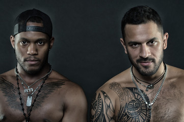 Fashion models isolated on black background. Brutal men with tattooed bodies. Sportsmen with...
