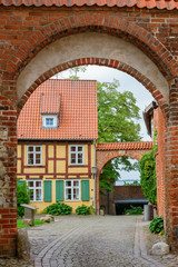 entrance arch to a square at the Johanniskloster in the UNESCO protected old town of Stralsund, Germany