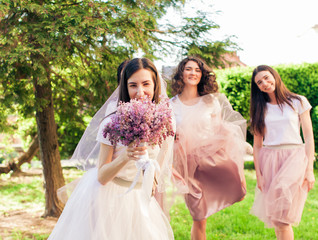 The bride and bridesmaids rest