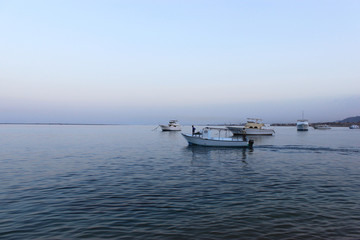 Boats and fisherman on it. Fishing on the Red sea, Safaga, Egypt.