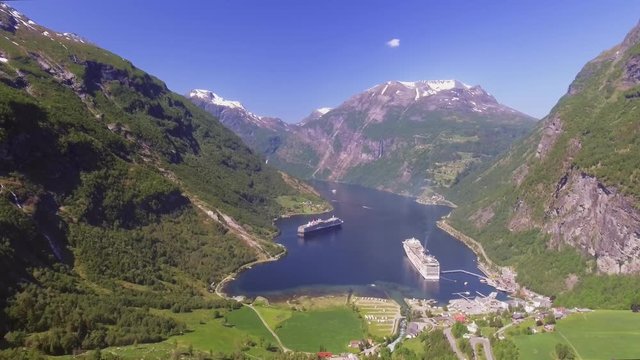 Geiranger fjord area, Norway. Aerial view at summer time. Fairytale landscape with its majestic, snow-covered mountain tops. Fantastic view of one of most beautiful tourist destinations in the world