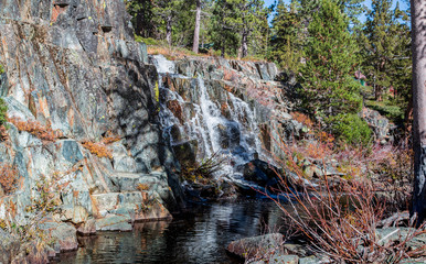 water fall over rocks during autumn