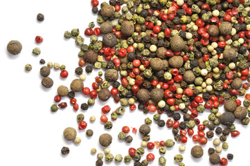 Black, red and white pepper grains isolated on white. Spice. Food.