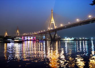 Bhumibol bridge 1&2 so called Industrial Ring Bridge crossing The Chao Phraya River with reflection, Bangkok, Thailand