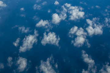 Beautiful white clouds forming and moving in blue sky 