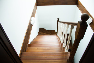 Stylish wooden stairs in modern elegant hallway