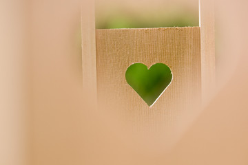 heart shaped cutout in wooden wall